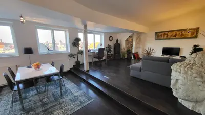 a living room with a couch and a table at Luxury Apt - View of the Center of Prague in Prague