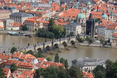 a view of a city with a bridge over a river at New large apartment, Free Parking! in Prague