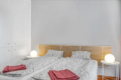 a bedroom with a bed with two towels on it at New large apartment, Free Parking! in Prague