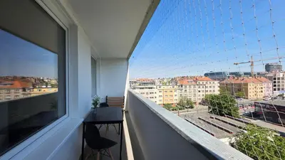 a balcony with a view of a city at 1BDR Dazzling Apartment only 8 min to Wenceslas Square in Prague
