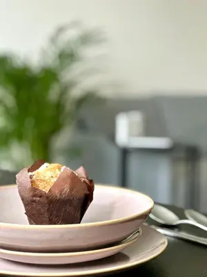 a piece of chocolate cake on a plate on a table at 1BDR Dazzling Apartment only 8 min to Wenceslas Square in Prague