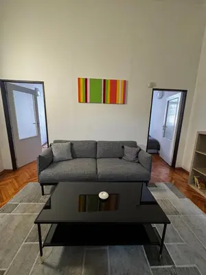 a living room with a couch and a yellow chair at Apartment Havlickova in Prague