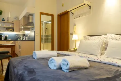 a bedroom with a large bed with towels on it at Cozy retreat in the Old Town in Prague
