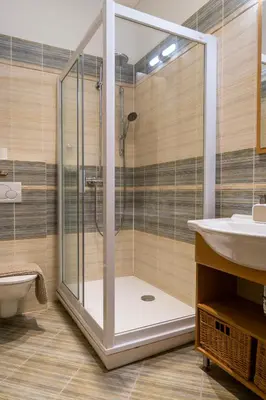 a bathroom with a shower and a sink at Cozy retreat in the Old Town in Prague