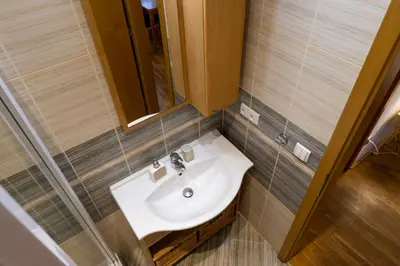 a bathroom with a sink and a mirror at Cozy retreat in the Old Town in Prague