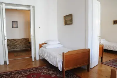 a bedroom with a bed and a couch at Large Apartment sleeps up to 10 M4A in Prague