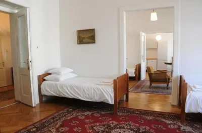 a bedroom with a bed and a living room at Large Apartment sleeps up to 10 M4A in Prague