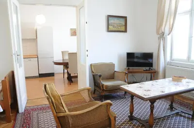 a living room with a table and chairs at Large Apartment sleeps up to 10 M4A in Prague