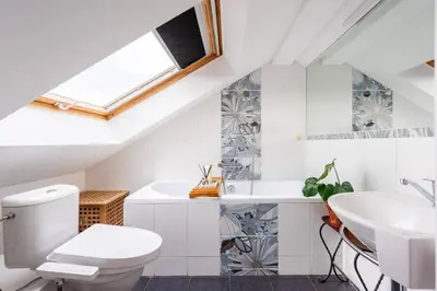 a bathroom with a toilet and a sink at Charming Prague Apartment in Vrovice with Roof Terrace in Prague