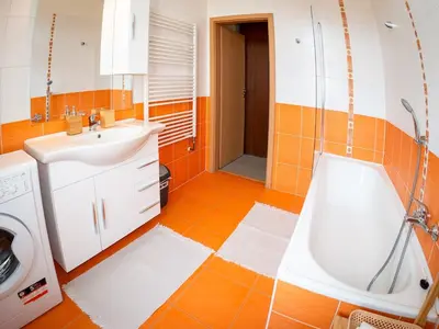 a bathroom with a sink and a bath tub at Comfortable apartment in Prague 8 - Libeň in Prague