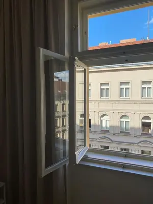 a window with a view of a building at Modern Apartments Letna in Prague