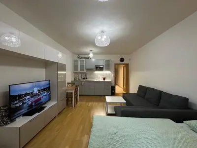 a dining room with a table and chairs at Garden Towers Residence - Underground Parking in Prague
