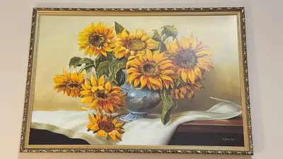 a painting of a vase with sunflowers in it at Newly renovated apartment in Wenceslas square in Prague