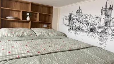 a bedroom with a bed with a drawing on the wall at Newly renovated apartment in Wenceslas square in Prague