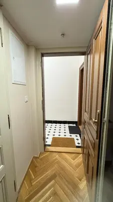 an empty room with a room with a tile floor at Newly renovated apartment in Wenceslas square in Prague