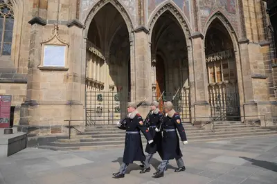three girls in uniform walking in front of a building at Riverside Hideout in Prague