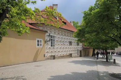 a group of people walking past a building at Riverside Hideout in Prague