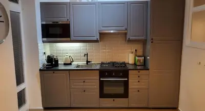 a kitchen with a sink and a stove top oven at Premium Apt - Free Massages from Physiotherapists in Prague