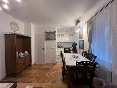 a kitchen and dining room with a table and chairs at Luxe-Boutique Apartments in Prague