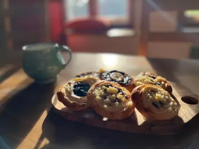 a group of donuts on a wooden plate on a table at Chalupa Na Vyhlídce in Sudoměř