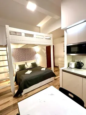 a bedroom with a bed and a bunk bed at Elly Modern Oldtown Apartments in Prague