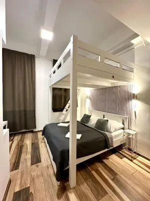 a bedroom with a bunk bed in a room at Elly Modern Oldtown Apartments in Prague