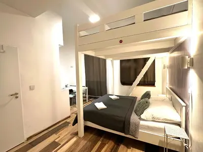 a bedroom with a bunk bed in a room at Elly Modern Oldtown Apartments in Prague