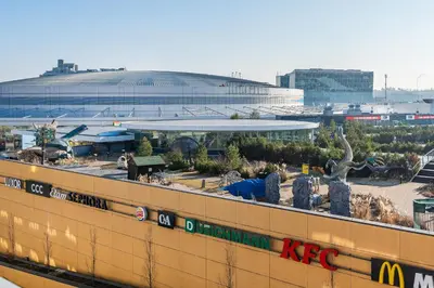 a view of a stadium with a building in the background at Rentero One bedroom O2 Arena Dinopark Apartment in Prague