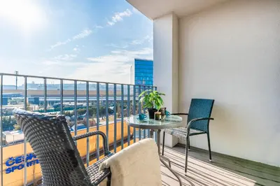 a balcony with a table and chairs on a balcony at Rentero One bedroom O2 Arena Dinopark Apartment in Prague