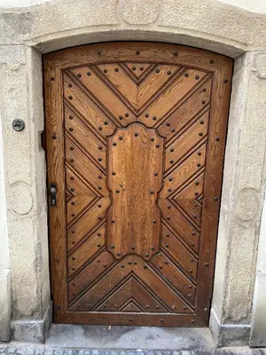 a wooden door in a stone building at Prague Romantic Apartment near Charles Bridge in Prague