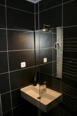 a bathroom with a sink and a mirror at Bnest in Beroun