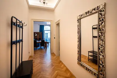 a large mirror on a wall in a hallway at OLD TOWN - 3 Room 2 Bathroom Balcony in Prague