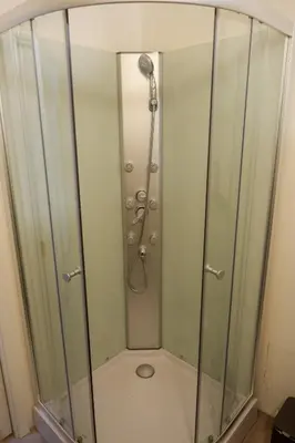 a shower with a glass enclosure in a bathroom at Malebný byt pod hradem Křivoklát in Křivoklát