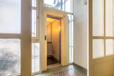 an open door in a room with a hallway at Sunny luxury apartments Grebovka in Prague