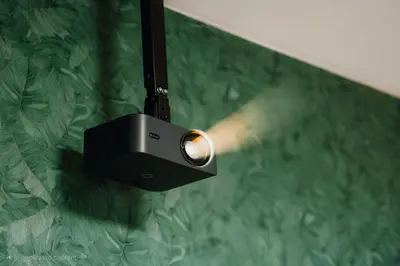 a light hanging from a wall with a gun at Cinematic Apartment with Pool Table & Cinema room in the heart of Prague in Prague