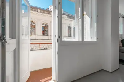 an open door with a view of a building at The Grand Krocínova Loft - Golden Bond Retreat in Prague