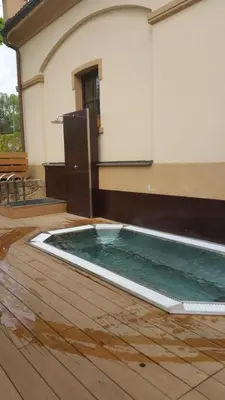 a swimming pool in front of a building at Pension U Hastrmana in Prague