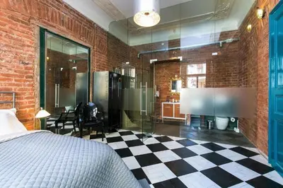 a bedroom with a bed and a checkerboard floor at OLD TOWN - 4 Room 2 Bathroom Apartment in Prague