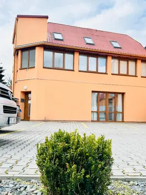 a house with a car parked in front of it at Villa Apartments with Free Parking Prague 5 in Prague