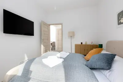 a bedroom with a bed with towels on it at 2 bedroom apartment with a terrace near the metro in Prague