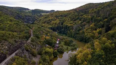 an aerial view of a river in a forest at Domeček Pikovice in Píkovice