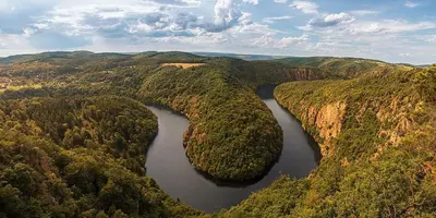 an aerial view of a river in a forest at Domeček Pikovice in Píkovice