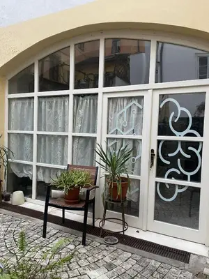 a door with plants and a bench in front of it at CozyGem House 2