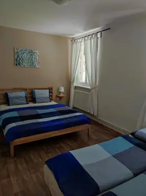 a bedroom with two beds and a window at Lávka 222 Chocerady in Chocerady