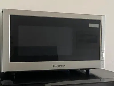 a computer monitor sitting on top of a shelf at NEW apartment in Prague in Prague