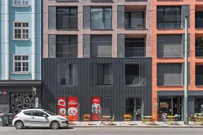 a silver car parked in front of a building at REAL Living by REFA Karlin 305 in Prague