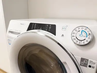 a washing machine with a digital clock on it at REAL Living by REFA Karlin 208 in Prague
