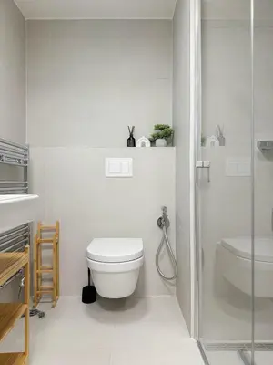 a bathroom with a toilet and a sink and a shower at REAL Living by REFA Karlin 208 in Prague