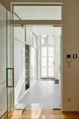 an open hallway with a glass door and a hallway with a door at Modern & Elegant, 3 min of Wenceslas Square in Prague