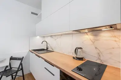 a kitchen with a sink and a counter at REAL Living by REFA Karlin 307 in Prague